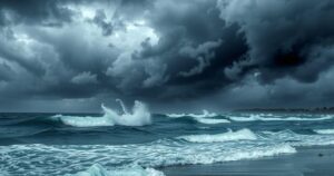 A stormy sky over a coastal area in the Philippines, with dark clouds and waves crashing against the shore.